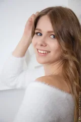 Evelina posing naked in a white top with open legs Preview picture 3