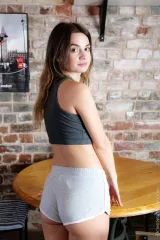 Small tits teenager Trinity Free with open legs on table Preview picture 1