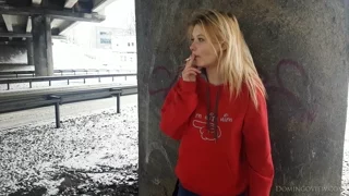 Stasey smokes on the street frame 8